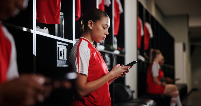 Rest, soccer and woman with phone in locker room for social media, contact and communication for game. Athlete, football and person typing on smartphone for match, training and tournament schedule