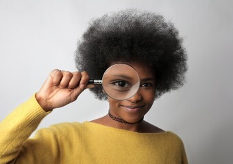 portrait of woman with magnifying glass