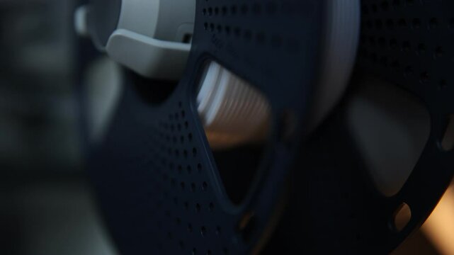 Close-up shot of a 3D printer filament spool that is not unwinding properly. 
