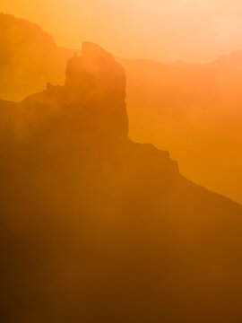 Ethereal silhouette of Roque Nublo at sunset
