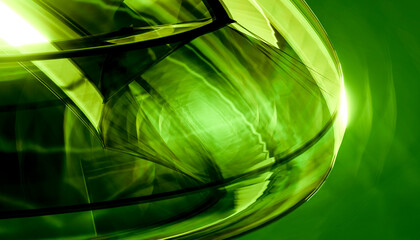 Abstract green glass spiral design with light reflections