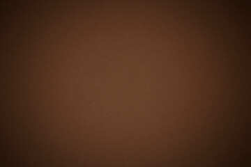 close up of coffee color cardboard texture with shadowed edges
