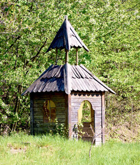  small wooden structure resembling a chapel with two pitched roofs