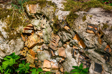 Old concrete block filled with broken bricks