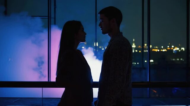 Two people gaze into each other's eyes on a high-rise balcony with colorful smoke in the background. Concept of intimacy and city romance.