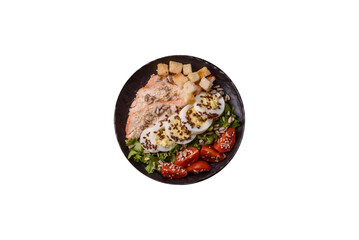 Bowl with caesar salad with chicken, parmesan cheese, tomatoes, croutons, lettuce leaves