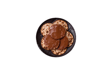 Matzah with chocolate paste for the Jewish holiday of passover