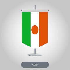 Niger vertical table flag on light grey background. Niger vertical desk flag isolated on grey background	
