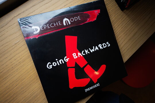 Depeche Mode Going Backwards remixes vinyl album cover displayed on wooden surface
