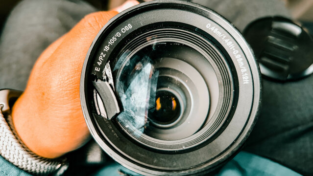 a close up of a camera lens cracked on the side
