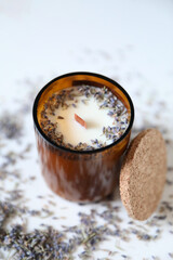 lavender candle in a glass from a recycled brown bottle