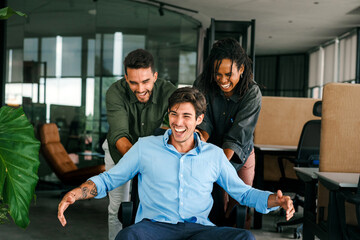 Happy diverse business team celebrating success and having fun all together