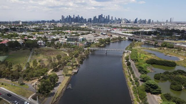 Aerial drone over Maribyrnong River, moving towards Melbourne city skyline