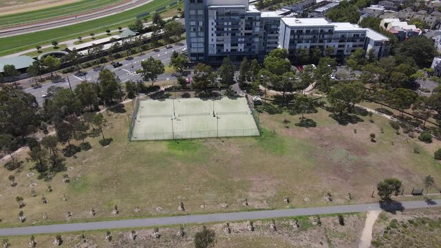 Aerial drone above local tennis court in Kensington, Melbourne, on a sunny day