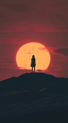 Fototapeta premium Solitary figure sunset silhouette dramatic landscape
