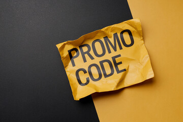 Wrinkled yellow paper with black "Promo Code" text on black and yellow background, showcasing a promotional offer concept, ideal for advertising