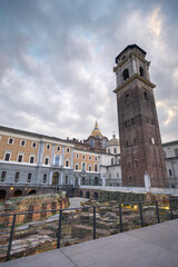 Explore the historical beauty of the clock tower of the Cathedral in Turin, Italy during a serene evening