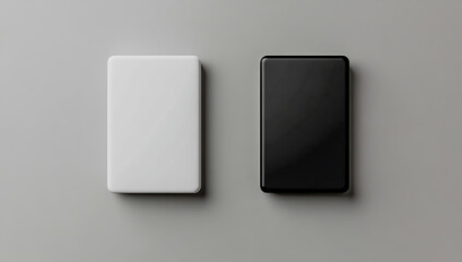 Minimalist composition of two rectangular objects in contrasting white and black colors