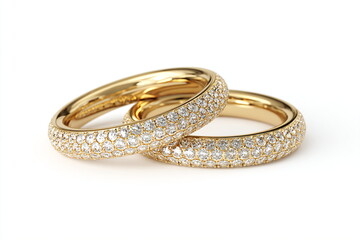Two gold wedding rings with diamonds isolated on white background. Close up.