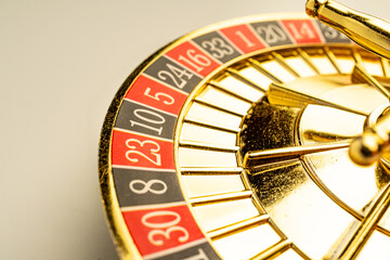 Close-up of spinning gold roulette wheel, suggesting suspense or potential fortune Represents...