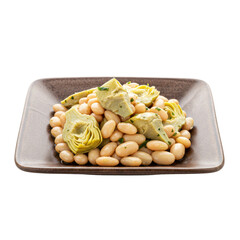 A close-up of a gourmet dish featuring artichokes and white beans served on a plate