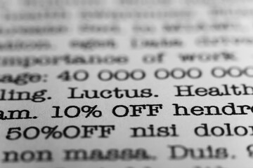 10 percent off. Text printed on a page. A piece of paper with a phrase. Marketing.