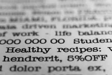 Healthy recipes. Text printed on a page. A piece of paper with a phrase written in retro typewriter...