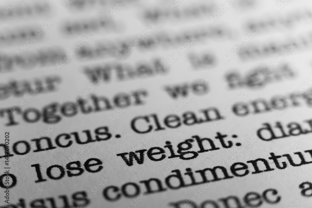Fototapete lose weight. text printed on a page. a piece of paper with a phrase written in retro typewriter font