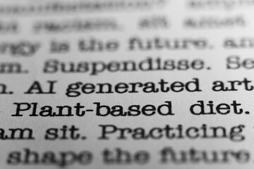 Plant based diet. Text printed on a page. A piece of paper with a phrase written in retro...
