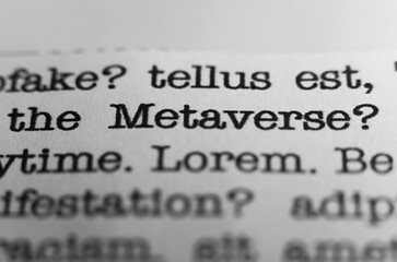Fototapeta premium The Metaverse. Text printed on a page. A piece of paper with a phrase written in retro typewriter font