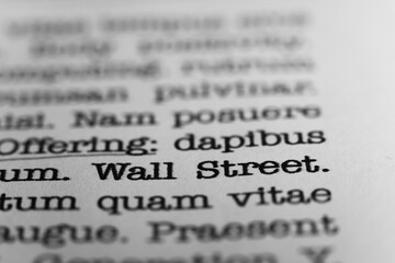Wall Street. Text printed on a page. A piece of paper with a phrase written in retro typewriter font