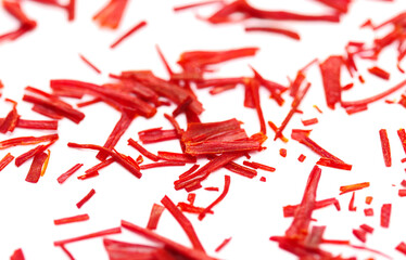 Close up dried saffron threads spice, isolated on white background, Crocus sativus, macro