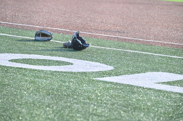 Sports Equipment on a Baseball Field