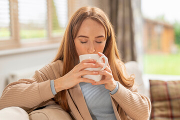 Cozy afternoon with a warm drink in a sunlit living room during autumn