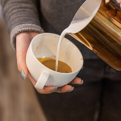 Barista coffee service concept.Barista women using coffee machine to make coffee in cafe