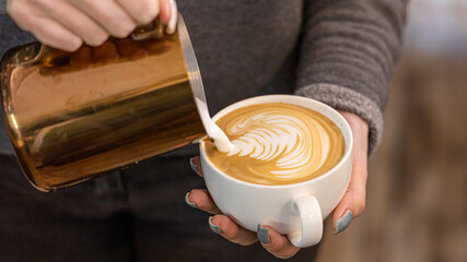 Barista coffee service concept.Barista women using coffee machine to make coffee in cafe