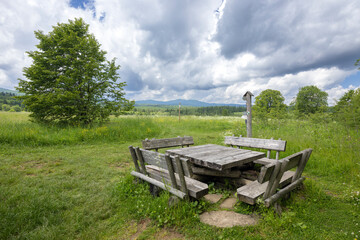 Wooden table and benches inviting hikers to rest in the Bieszczady Mountains, Poland