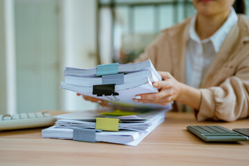 Businessman's hand searching for documents