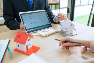Asian businessman, real estate agent, discussing home purchase price, fees, mortgage, interest,...