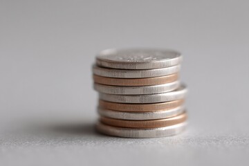 minimalistic photograph of stack of coins representing dividends isolated on white background