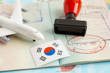 South Korea flag and passport with airplane for travel.