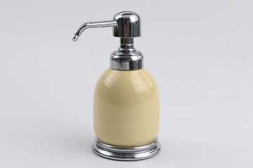 Beautifully designed cream dispenser with a chrome pump placed on a white background showcasing its elegant round shape and smooth finish