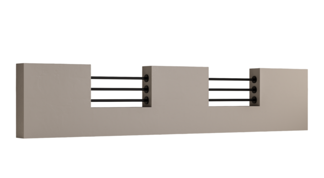 A wall with a black metal fence on it