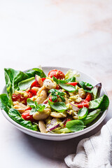 Butter bean salad with tomato, basil and avocado dressing.
