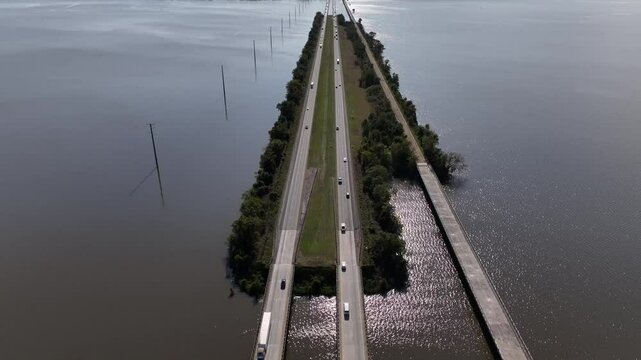 Traveling across America in cars and trucks driving across Lake Marion in South Carolina on Interstate 95 