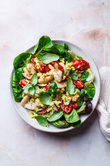 Butter bean salad with tomato, basil and avocado dressing.
