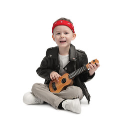 Cute little boy playing toy guitar on white background