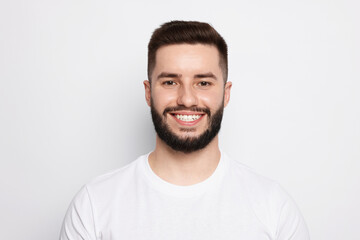 Portrait of handsome man on light background