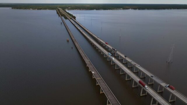 Traveling across America in cars and trucks driving across Lake Marion in South Carolina on Interstate 95 