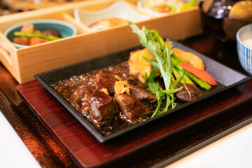 Japanese Teppanyaki Beef Steak with Vegetables on Hot Plate